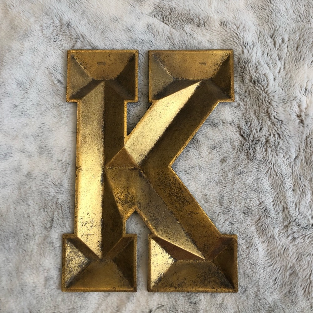 Gold metal letter ‘K’